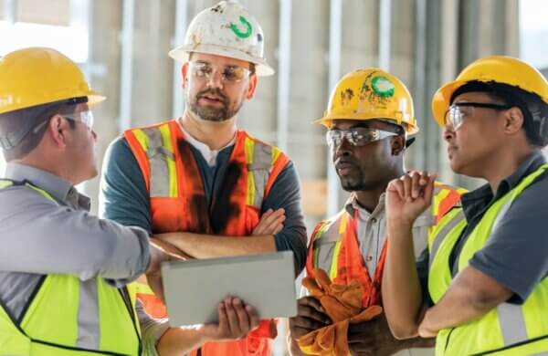 Group of construction workers and supervisors talking